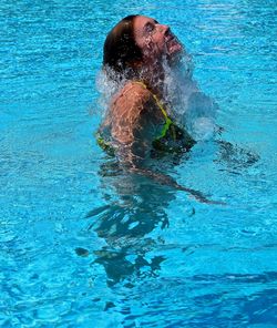 Woman swimming in pool