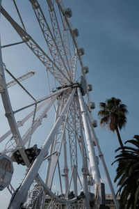 Low angle view of ferris wheel against sky