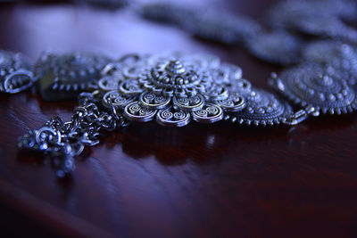 High angle view of jewelry on table