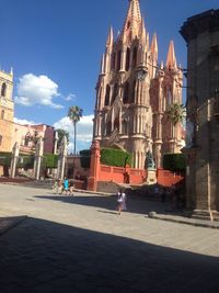 High angle view of church against blue sky