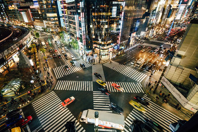 High angle view of city lit up at night