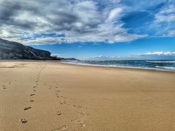 Scenic view of beach against sky