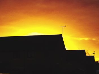 Silhouette of building at sunset