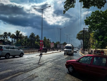 Cars on road against sky