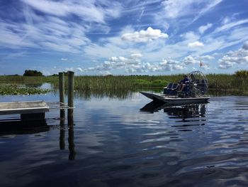 Boats in calm lake