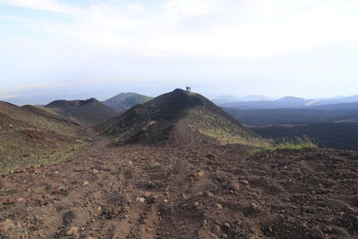 Scenic view of arid landscape against sky