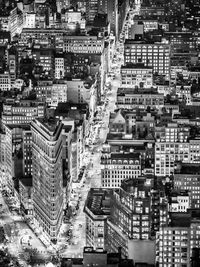 High angle view of illuminated buildings in city