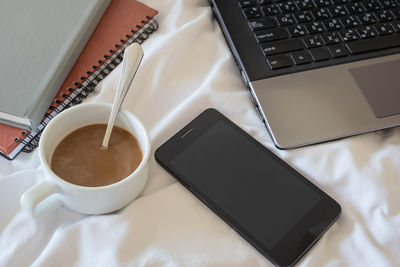 High angle view of coffee cup on table