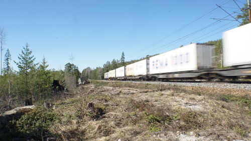 Train on railroad track against sky