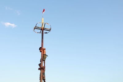 Low angle view of street light against sky