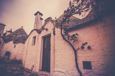 Low angle view of old building against sky