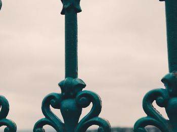 Close-up of metal against sky