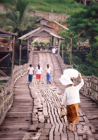 Woman walking on footpath