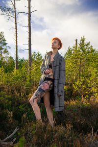 Full length of woman standing on field