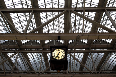 Low angle view of illuminated ceiling at railroad station