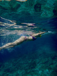 High angle view of girl swimming in sea