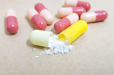 High angle view of pills against white background