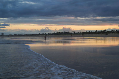 Scenic view of sea against sky at sunset