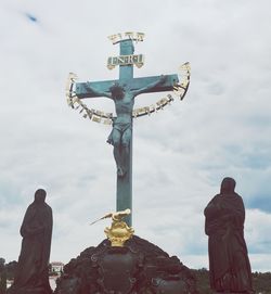 Low angle view of statue against sky