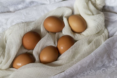 High angle view of eggs on bed