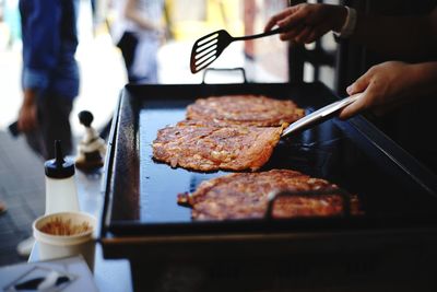 Close-up of hand making korean traditional snack