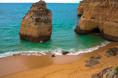 Scenic view of rocks in sea