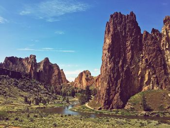 Panoramic view of rock formations on landscape against sky