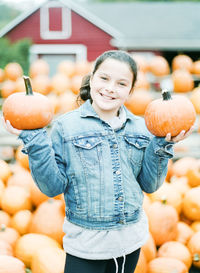 Smiling girl with pumpkins, new jersey, usa