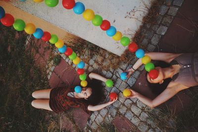 High angle view of people relaxing on floor