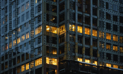 Low angle view of illuminated building at night