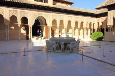 People in front of historical building