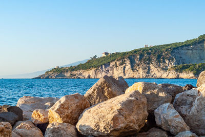 Scenic view of sea against clear blue sky