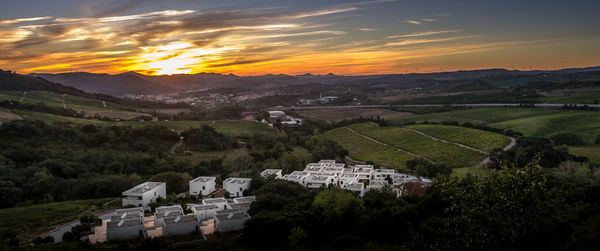 High angle view of houses and mountains against sky