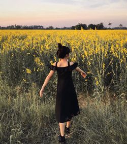 Woman standing on field