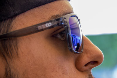 Close-up portrait of man wearing sunglasses