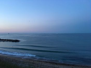 Scenic view of sea against clear blue sky