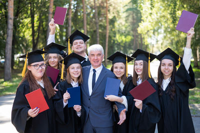 Portrait of woman wearing graduation gown