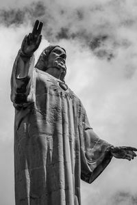 Low angle view of statue against sky