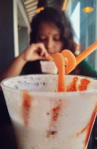 Portrait of girl drinking glass