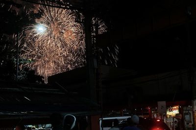 Low angle view of illuminated city at night