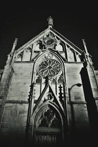 Low angle view of bell tower against sky