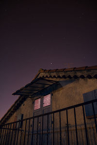 Low angle view of house against night sky