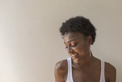 Portrait of a young woman with hoop earrings