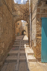 View of narrow alley amidst buildings