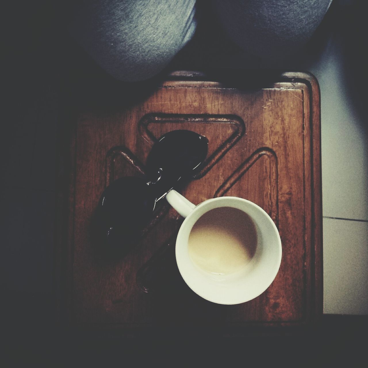 indoors, food and drink, table, still life, coffee cup, drink, close-up, coffee - drink, cup, coffee, high angle view, refreshment, spoon, directly above, home interior, wood - material, freshness, no people, holding, healthy eating