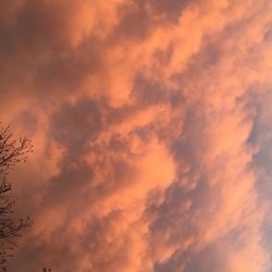 Low angle view of cloudy sky at sunset