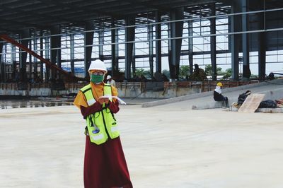 Portrait of woman working at construction site