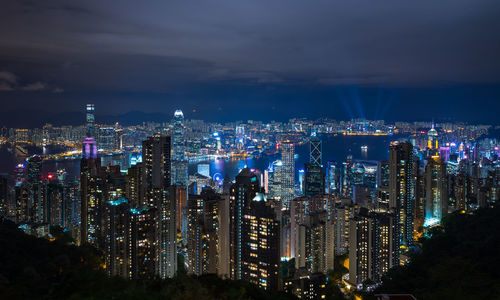 High angle view of city lit up at night