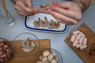 High angle view of person preparing food on table