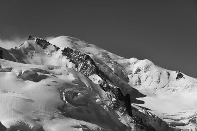 Scenic view of snow covered mountains